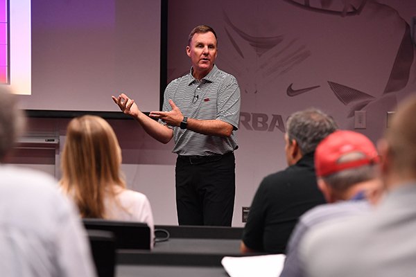 Arkansas coach Chad Morris talks to reporters during a media coaching clinic at Fred W. Smith Center in Fayetteville.