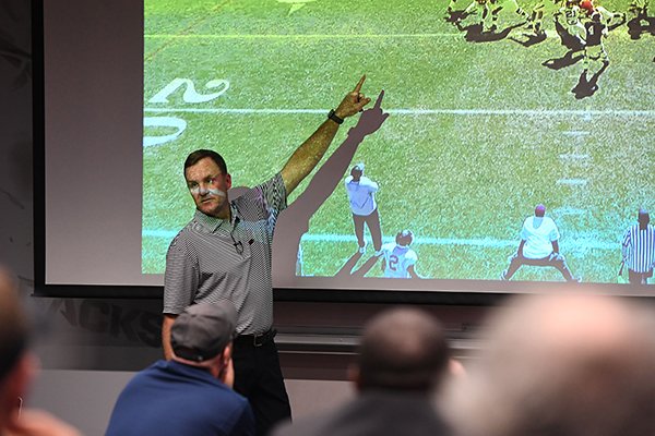 Arkansas coach Chad Morris talks to reporters during a media coaching clinic at Fred W. Smith Center in Fayetteville.	