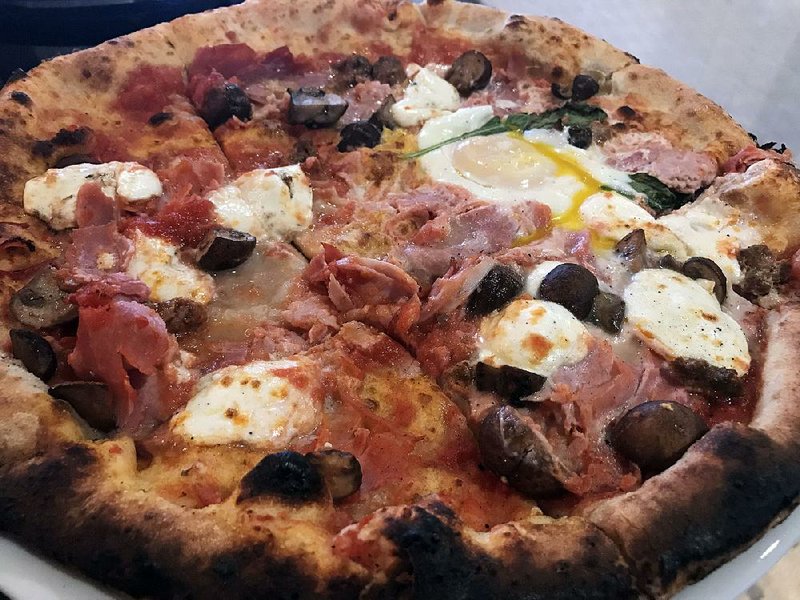 The Rosa Dama at Sauce(d) in Little Rock features San Marzano tomatoes, mozzarella, prosciutto cotto, Merguez sausage, mushrooms, egg and fresh basil. 