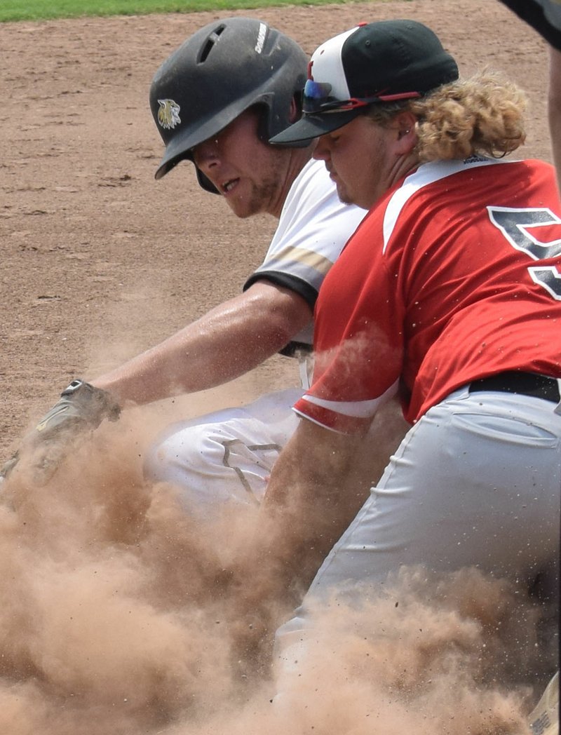 RICK PECK/SPECIAL TO MCDONALD COUNTY PRESS McDonald County third baseman Izak Johnson puts the tag on a Neosho runner during McDonald County's 4-2 win on June 2 in the Carl Junction 18U Baseball Tournament.