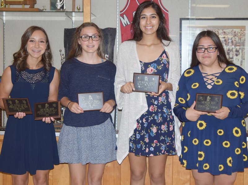 RICK PECK/SPECIAL TO MCDONALD COUNTY PRESS Members of the 2018 McDonald County High School girls' soccer team recently received awards at a banquet held at MCHS. From left to right: Kaycee Factor, Freshman of the Year and JV Most Valuable Player; Azlen Smith, Mustang Award; Nicole Salas, Most Improved; and Esmerelda Estrada, JV Defensive Player of the Year. Not present: Ava Smith, Offensive Player of the Year and Kaylee Eberley, Most Valuable Player.