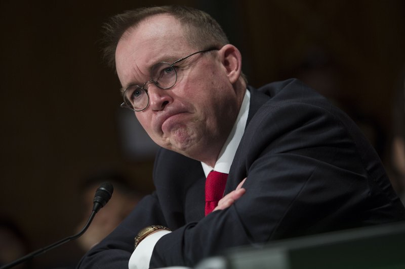 Mick Mulvaney, acting director of the Consumer Financial Protection Bureau), listens during a Senate Banking committee hearing in Washington on April 12, 2018. 