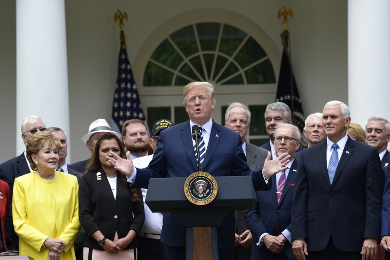 President Donald Trump participates in a bill signing ceremony for the "VA Mission Act" in the Rose Garden of the White House, Wednesday, June 6, 2018, in Washington. 