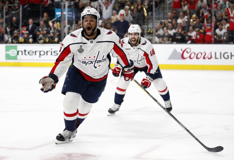 Washington Capitals right wing Devante Smith-Pelly, left, celebrates his goal, in front of center Chandler Stephenson during the third period in Game 5 of the NHL hockey Stanley Cup Finals against the Vegas Golden Knights on Thursday, June 7, 2018, in Las Vegas. (AP Photo/John Locher)

