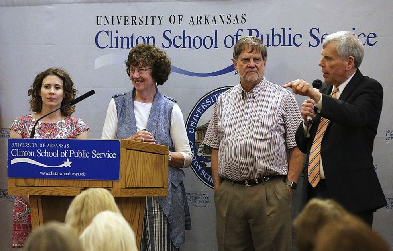 Arkansas Repertory Theatre’s Anna Kimmell (from left), Ruth Shepherd and Bill Rector listen Thursday to Skip Rutherford, dean of the University of Arkansas Clinton School of Public Service, during a discussion about the future of The Rep.  