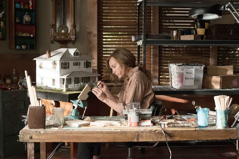 Annie (Toni Collette) is an artist grieving her mother in the atmospherically spooky Hereditary, the debut film by Ari Aster. 
