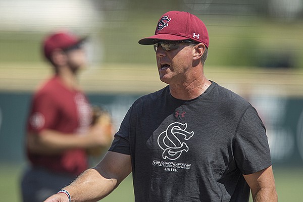 South Carolina coach Mark Kingston talks to players during practice Friday, June 8, 2018, in Fayetteville. 