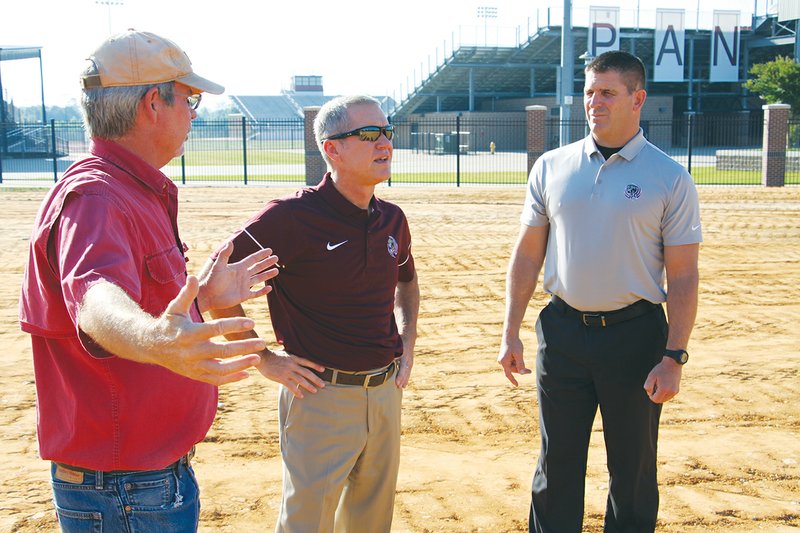 Benton School District Plant Manager Kevin Chastain, left, talks with Superintendent Mike Skelton and Athletic Director Scott Neathery on Thursday morning at the site of the new Panthers baseball stadium. On May 14, the Benton School Board approved a bid of nearly $4 million from Nabholz Construction to relocate the baseball stadium to the Benton Athletic Sports Complex. The new stadium will parallel the softball field, which was built in 2009. 