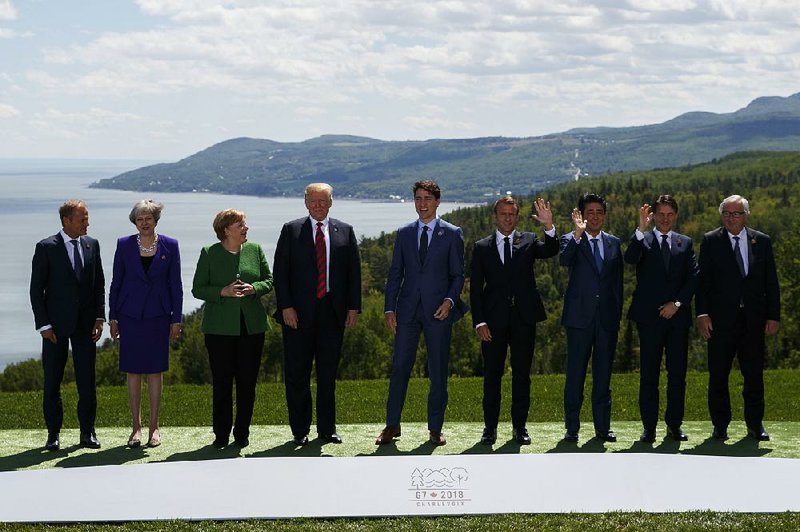 Donald Trump and other G-7 leaders pose for their “family portrait” Friday in Charlevoix, Quebec.