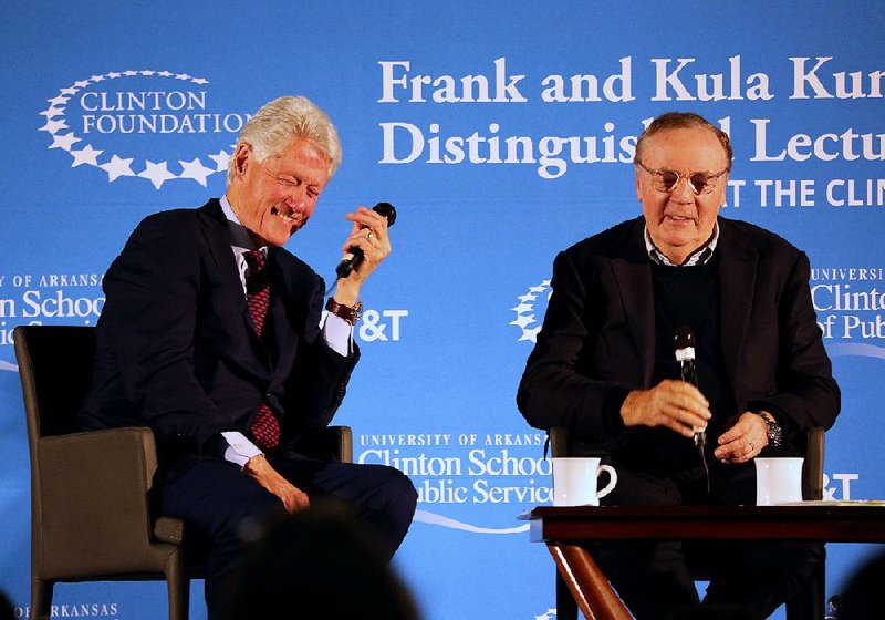 Former President Bill Clinton (left) shares a laugh with author James Patterson while talking about The President is Missing, the book they co-wrote, during a panel discussion Saturday in Little Rock. 