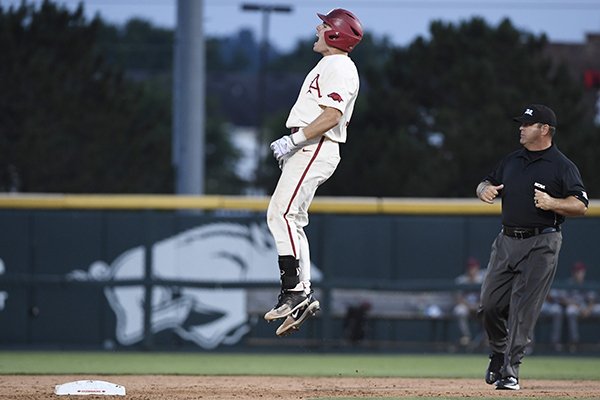 Arkansas baserunner Carson Shaddy celebrates after hitting a three-run double against South Carolina in the seventh inning of an NCAA college baseball tournament super regional baseball game in Fayetteville, Ark., Saturday, June 9, 2018. (AP Photo/Michael Woods)

