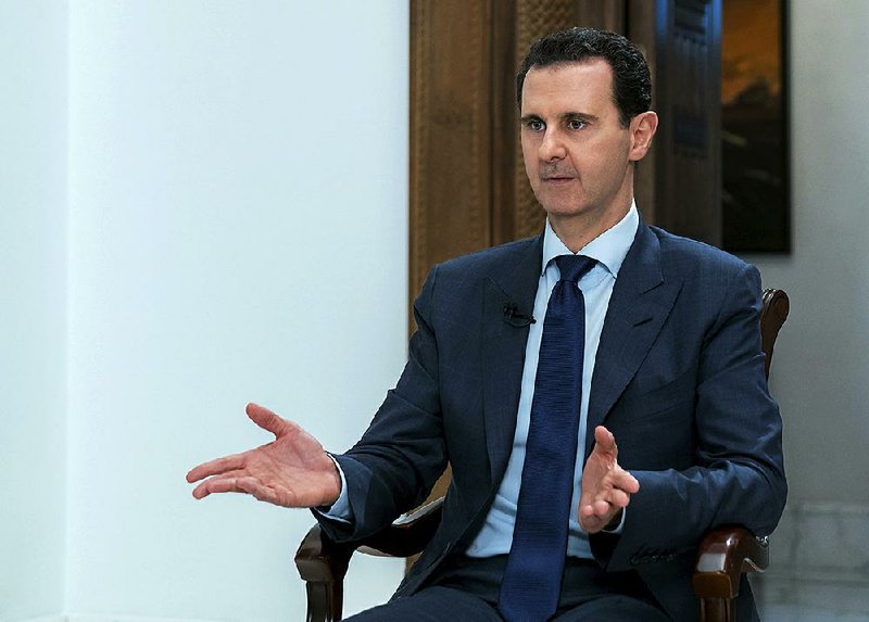 Syrian President Bashar Assad speaks Sunday during an interview with the Daily Mail, in Damascus, Syria.  