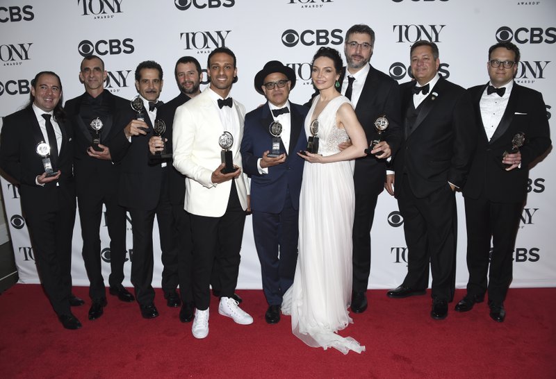 Cast and crew of "The Band's Visit" pose in the press room with the award for best musical at the 72nd annual Tony Awards at Radio City Music Hall on Sunday, June 10, 2018, in New York. (Photo by Evan Agostini/Invision/AP)