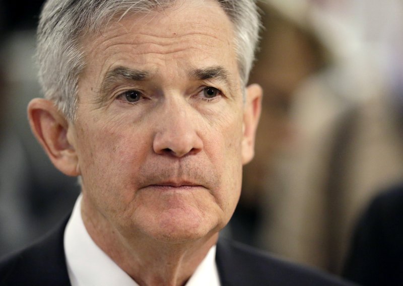 FILE- In this April 6, 2018, file photo, federal Reserve Chairman Jerome Powell listens as he tours mHUB during a visit in Chicago. Investors are eagerly awaiting the updated economic forecasts the Fed will issue when its meeting ends Wednesday, June 13. (AP Photo/Charles Rex Arbogast, File)