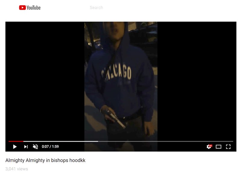 A frame from video posted on YouTube on Oct. 27, 2016, in which a member of one of Chicago gangs was filmed walking into the territory of another gang with a gun in his hand. New law enforcement materials compiled by the Chicago Crime Commission say the embrace of social media by gangs to taunt rivals is the biggest change in how gangs operate compared with 10 years ago. (YouTube via AP)