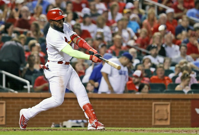 St. Louis Cardinals' Marcell Ozuna hits a two-run home run during the fifth inning of a baseball game against the San Diego Padres Monday, June 11, 2018, in St. Louis. (AP Photo/Jeff Roberson)