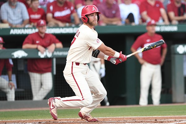 Luke Bonfield singles to right field in Arkansas' 14-4 win over South Carolina Monday June 11, 2018 during the NCAA Super Regional at Baum Stadium in Fayetteville.