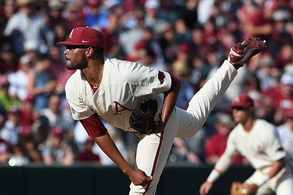 Arkansas' Isaiah Campbell pitches against South Carolina Monday June 11, 2018 during the NCAA Super Regional at Baum Stadium in Fayetteville.