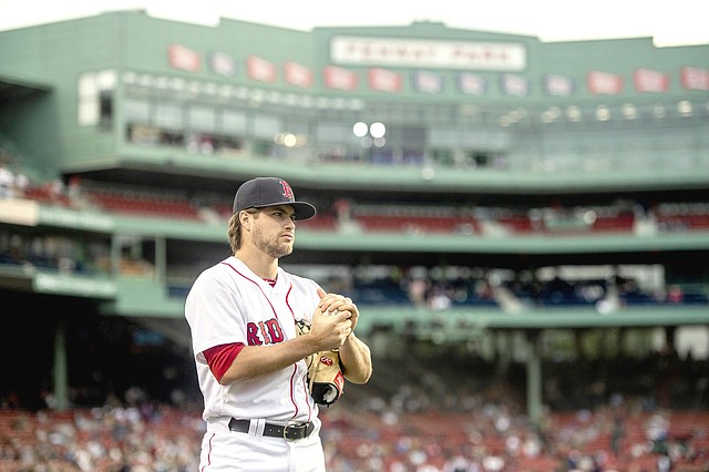 Photo by Matthew Thomas/Boston Red Sox Former Prairie Grove and Arkansas pitcher turned professional Boston Red Sox pitcher Jalen Beeks warms up in the outfield before his first start as a member of the Red Sox before the Boston Red Sox face the Detroit Tigers at Fenway Park in Boston, Massachusetts on Thursday, June 7, 2018.