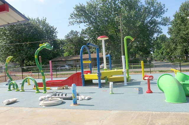 Westside Eagle Observer/SUSAN HOLLAND New playground equipment is nearing completion at the Gravette aquatic park. The water park, pavilions and waterslide await use by youngsters when the park opens at 1 p.m. Friday, June 15. Pool admission is $3, or $1.50 from 5 to 7 p.m.