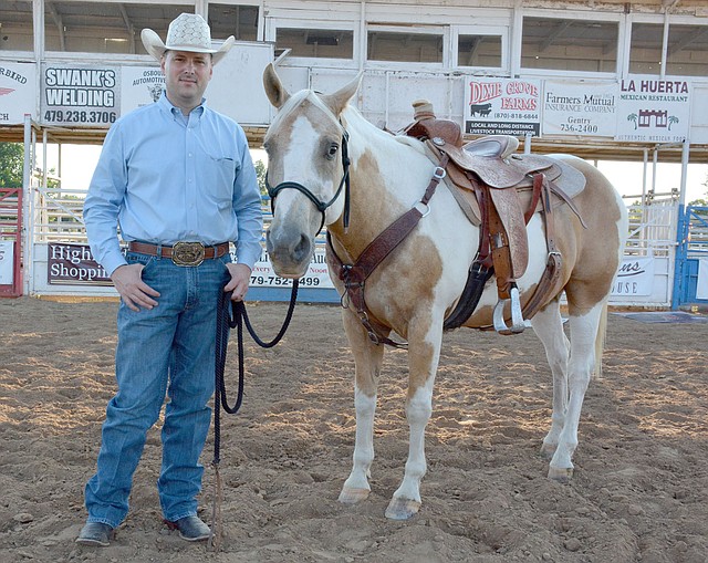 Graham Thomas/Herald-Leader Siloam Springs Rodeo announcer Jeff Lee and his horse and co-star Dusty will be in action this week at the 60th annual Siloam Springs Rodeo.