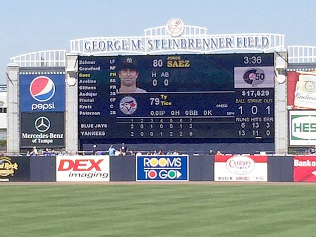 Submitted photo Prairie Grove 2014 graduate Ty Tice's name is shown on the scoreboard during the seventh inning of a spring training game between the visiting Toronto Blue Jays at New York Yankees' George M. Steinbrenner Field at Tampa, Fla. Jorge Saez was among four batters Tice faced while pitching two-thirds of an inning on Saturday, March 24, 2018.