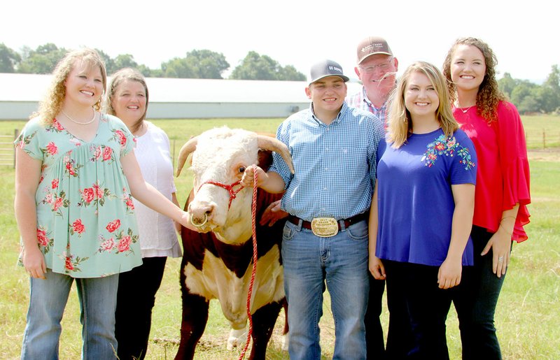 LYNN KUTTER ENTERPRISE-LEADER Jerry and Dyanna Moyer and their two daughters, Cheyenne and Caleigh, are the 2018 Washington County Farm Family of the Year. They are pictured above with two others they consider part of their extended family, niece Dixie Miller and friend Paul Cole. See next week's Enterprise-Leader for more information on the Moyers and their poultry and cattle farm in Lincoln.