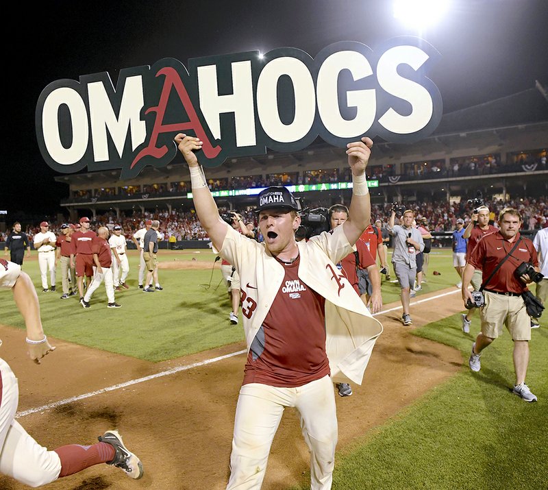 The Associated Press #OMAHOGS: Arkansas junior catcher Grant Koch celebrates after the Razorbacks' 14-4 victory Monday over South Carolina to win the Fayetteville Super Regional at Baum Stadium. The Razorbacks will meet the Texas Longhorns on Sunday at the College World Series in Omaha, Neb.