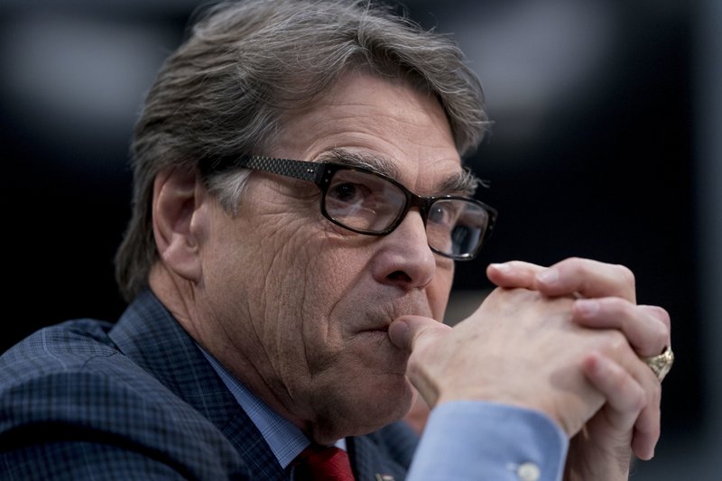 FILE - In this March 15, 2018 photo, Energy Secretary Rick Perry appears before a House Appropriations subcommittee hearing on Capitol Hill in Washington. Perry is defending President Donald Trump's call to bolster struggling coal-fired and nuclear power plants, saying a rash of plant retirements is "alarming"and poses a looming crisis for the nation's power grid. (AP Photo/Andrew Harnik)