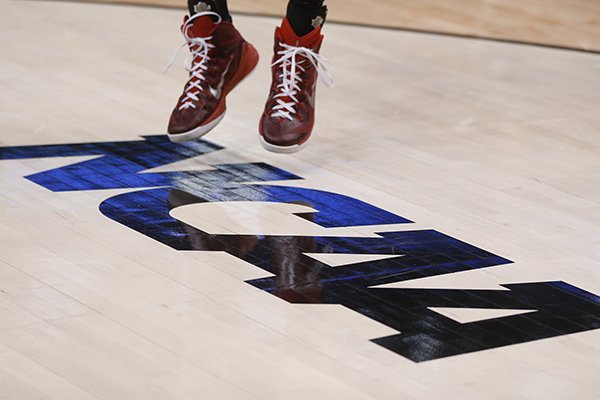 A Lafayette basketball player shoots a jump shot on the NCAA floor logo during practice for an NCAA college basketball second round game in Pittsburgh Wednesday, March 18, 2015. (AP Photo/Keith Srakocic)

