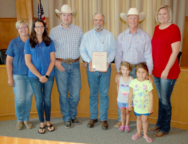 Members of the Siloam Springs Riding Club met at City Hall on Monday morning as Mayor John Mark Turner issued a proclamation declaring June 14-16 as Siloam Springs Rodeo Days. Pictured, from left, are Siloam Springs Riding Club members Karen Davis, Kari Hutchins, Jeff Lee, Turner, Dean Miller with Scarlett Thompson and Abigail Carnes in front, and Kaci Johnson. 