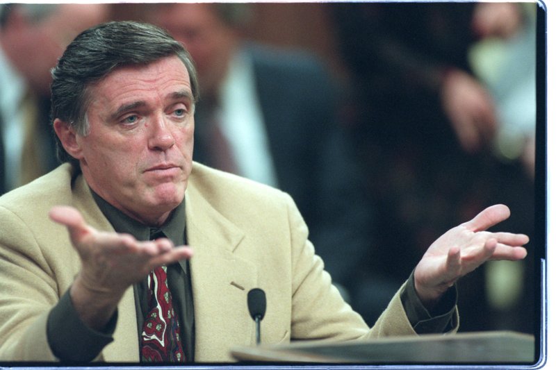 FILE PHOTO: Tom Dalton, then director of the state Department of Human Services, gestures while speaking during a 1997 meeting of the House Public Health, Welfare and Labor Committee.