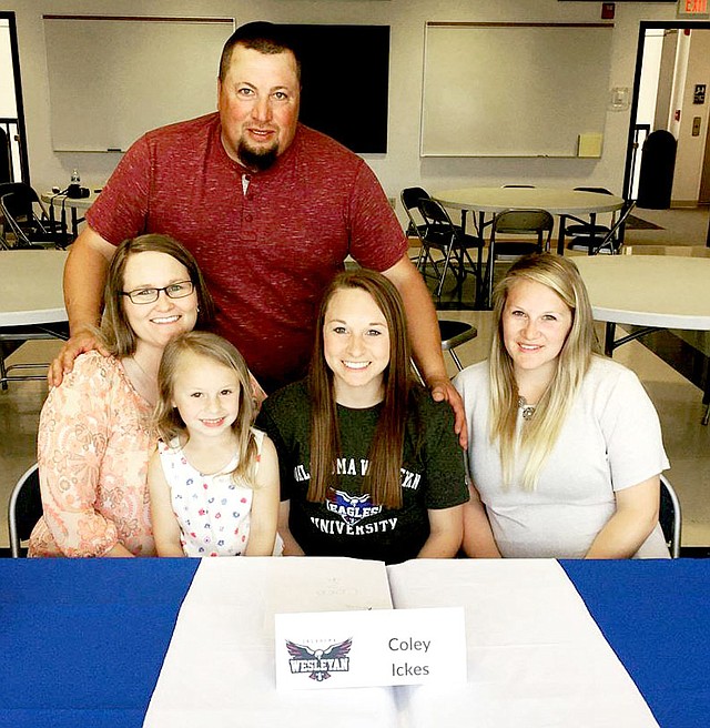 Courtesy photo Coley Ickes (center) celebrates her signing ceremony at a special event in May at Crowder College. The point guard will join the Oklahoma Wesleyan University women's college basketball team. Ickes' family was on hand to cheer her on, including her dad, Darryl; her mom, Shelly; with Ickes' niece, Rilynn Crain; and her sister, Kirstie Crain.
