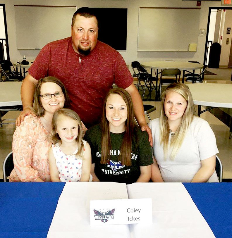 Courtesy photo Coley Ickes (center) celebrates her signing ceremony at a special event in May at Crowder College. The point guard will join the Oklahoma Wesleyan University women's college basketball team. Ickes' family was on hand to cheer her on, including her dad, Darryl; her mom, Shelly; with Ickes' niece, Rilynn Crain; and her sister, Kirstie Crain.