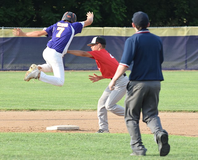RICK PECK/SPECIAL TO MCDONALD COUNTY PRESS McDonald County second baseman Josh Parsons tags out a Monett runner during McDonald County's 7-3 loss to Monett on June 12 in Monett.