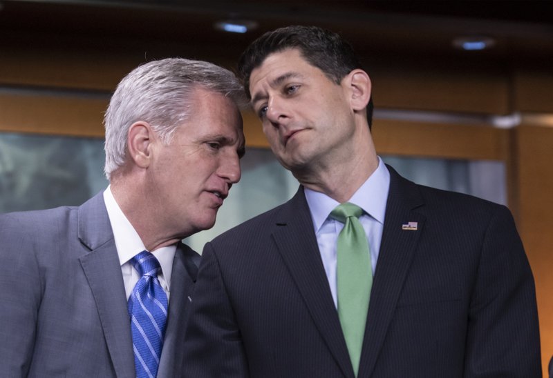 House Majority Leader Kevin McCarthy, R-Calif., and Speaker of the House Paul Ryan, R-Wis., confer during a news conference following a closed-door GOP meeting on immigration, on Capitol Hill in Washington, Wednesday, June 13, 2018. (AP Photo/J. Scott Applewhite)