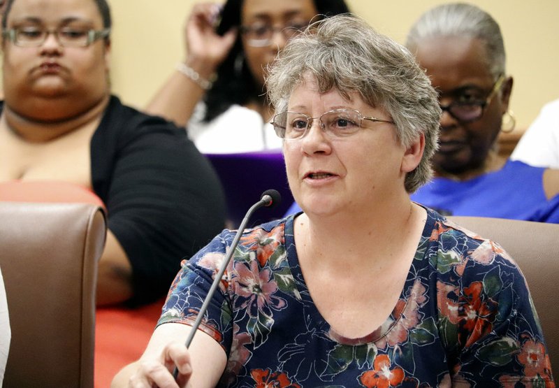Debbie Holt of Centerton tells the prisons subcommittee of the Arkansas Legislative Council in Little Rock on Thursday, June 14, 2018, that two incarcerated sons have received poor medical care behind bars. 
