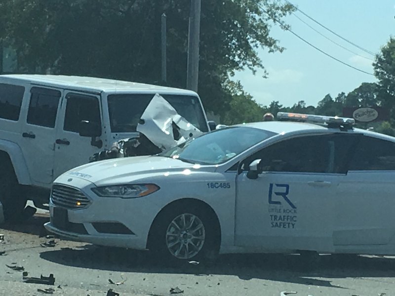 A Little Rock Traffic Safety vehicle collides with a 2016 Jeep Wrangler in an accident Tuesday at the intersection of Shackleford Road and Financial Centre Parkway.