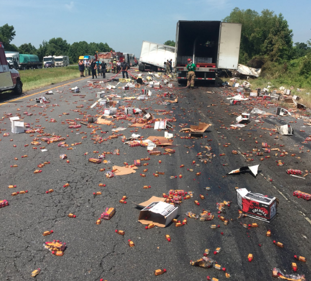 This photo posted on the Arkansas Department of Transportation Twitter account shows a wreck on I-40 that caused whiskey to spill across the highway on Thursday morning.