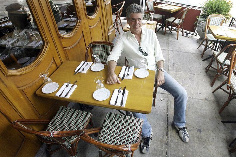 Anthony Bourdain poses in a New York restaurant when he was hosting the Travel Channel’s No Reservations, in 2007. 
