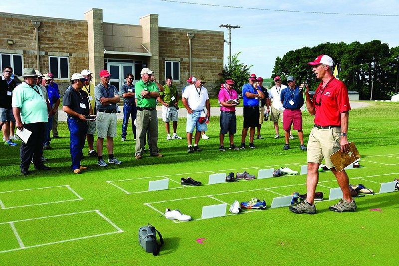 Douglas Karcher summarizes research into the effects of different types of shoe spikes on golf courses during the University of Arkansas’ biannual Turfgass Field Day in 2016 at the Agricultural Research Center in Fayetteville.  Douglas Karcher summarizes research into the effects of different types of shoe spikes on golf courses during the University of Arkansas’ biannual Turfgass Field Day in 2016 at the Agricultural Research Center in Fayetteville.  