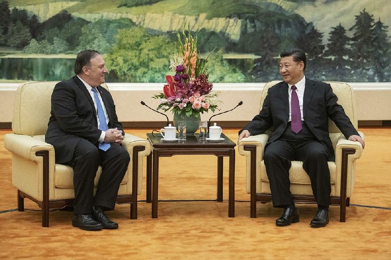 Secretary of State Mike Pompeo and Chinese President Xi Jinping meet Thursday at the Great Hall of the People in Beijing. Chinese officials declined to address questions about keeping tough sanctions against North Korea.  