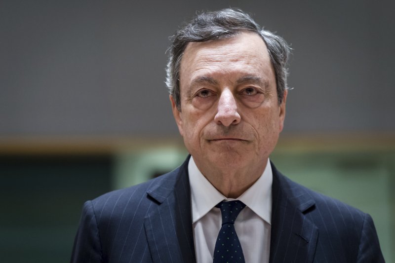 FILE - In this Thursday, May 24, 2018 file photo, President of the European Central Bank Mario Draghi arrives for an eurogroup meeting at the Europa building in Brussels. The European Central Bank said Thursday, June 14 it will phase out at year-end the bond-buying stimulus program credited with helping the 19 countries that use the euro recover from the Great Recession and eurozone debt crisis. (AP Photo/Geert Vanden Wijngaert, file)