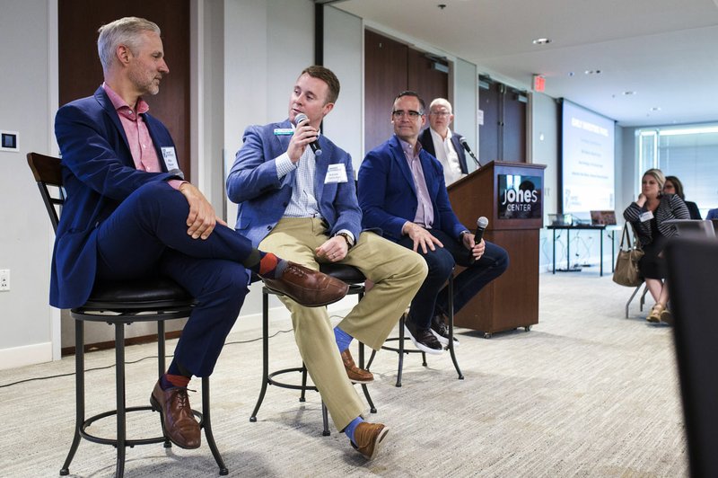 NWA Democrat-Gazette/CHARLIE KAIJO Mike Malone (from left), Runway Group director, Adam Rutledge, First Security Bank CEO, and Tom Hayes, Tyson Foods president, speak Thursday during the Summit for Downtown Springdale's Future Early Investors Panel at The Jones Center in Springdale.