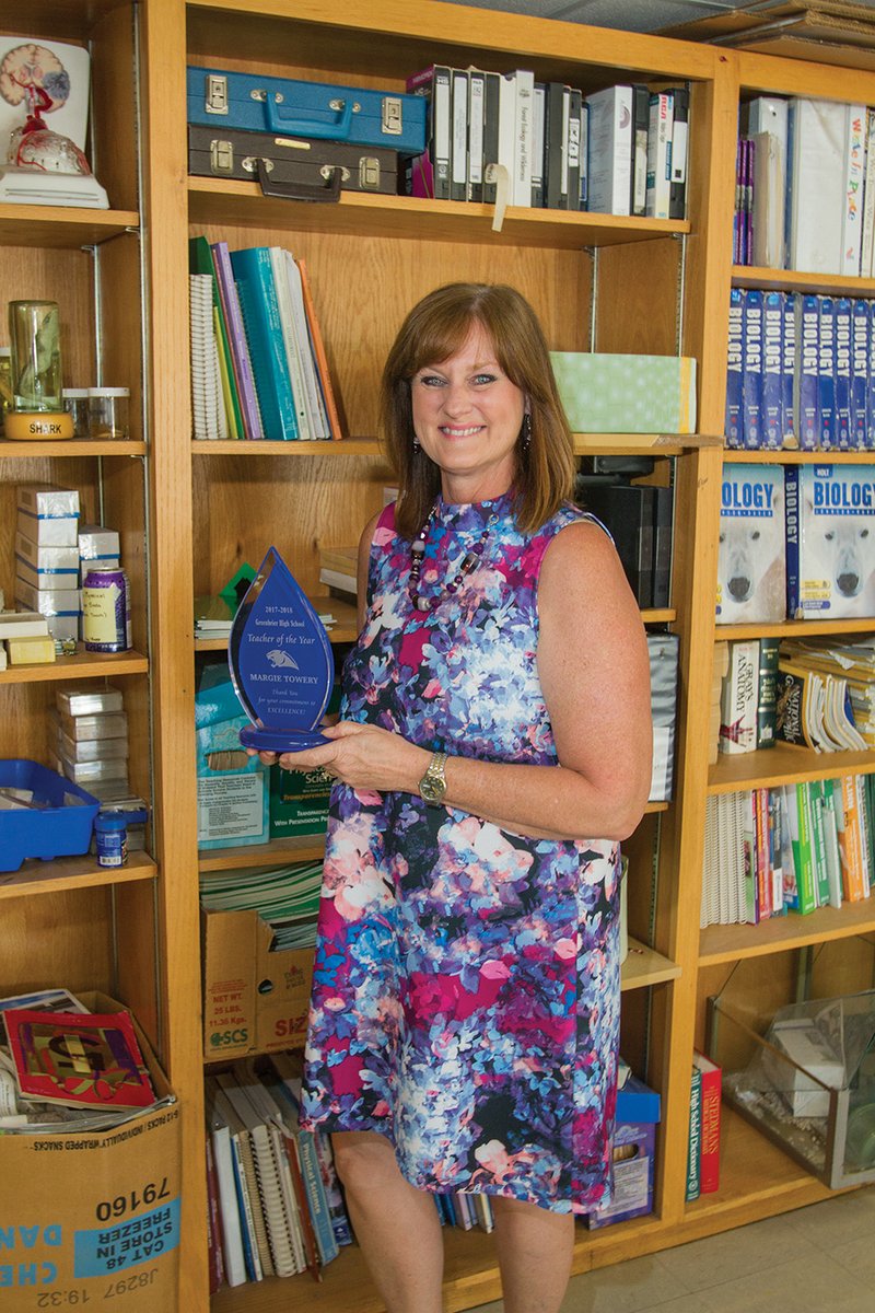 Margie Towery holds the award she received as Greenbrier School District Teacher of the Year. Towery, 58, said she never intended to teach in the public school system. She was a public-health educator and also taught at the University of Central Arkansas in Conway before taking a job at South Side Bee Branch High School.