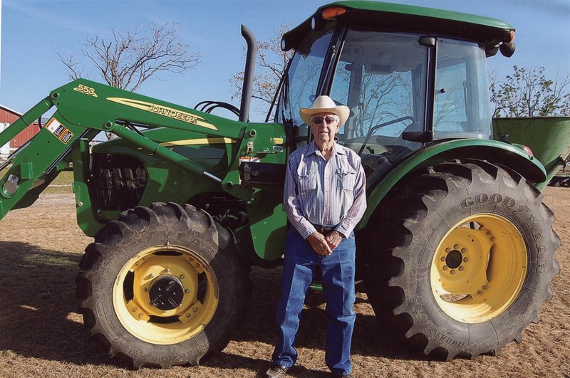 The Olen Wilson family of Timbo is the 2018 Stone County Farm Family of the Year. Wilson, shown here a few years ago with one of his tractors on the family farm, died June 9.