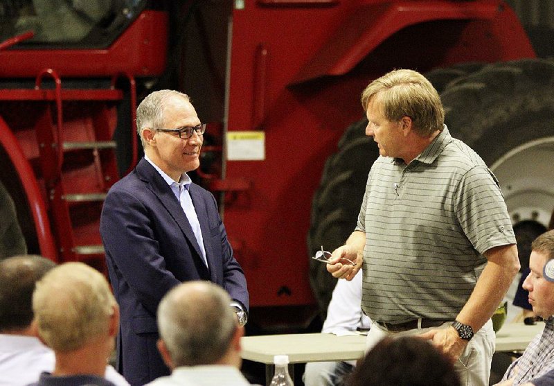 EPA chief Scott Pruitt (left) takes part in a forum earlier this week at a farm in Reliance, S.D., where he heard farmers’ concerns about government support for ethanol.  