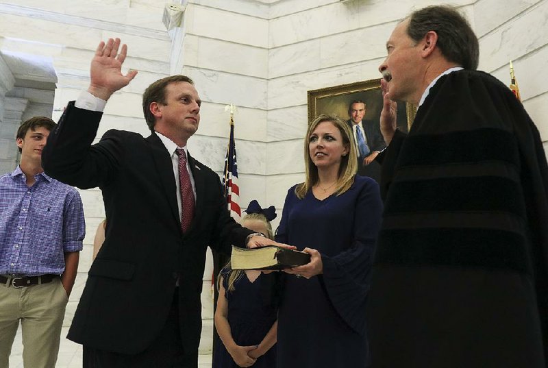 FILE - Rep. Matthew Shepherd is sworn as the new speaker of the House by Arkansas Chief Justice Dan Kemp. Shepherd was joined by his wife, Alie, and son, Eli (left). Also present were daughters Mary Kate and Libby.