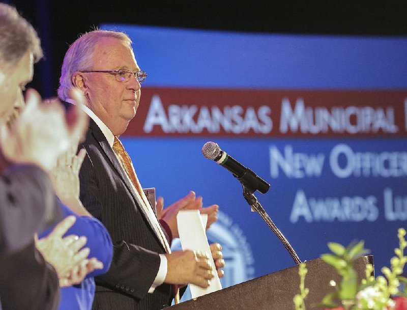 FILE — North Little Rock Mayor Joe Smith is applauded by Arkansas Municipal League members at a luncheon on June 15, 2018, during the group’s annual convention. 