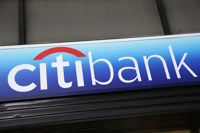 FILE - In this Jan. 15, 2015, file photo, a Citibank sign hangs above a branch office in New York. (AP Photo/Mark Lennihan, File)